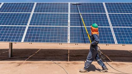 A worker cleans solar panels in the Atacama Desert in Chile.
