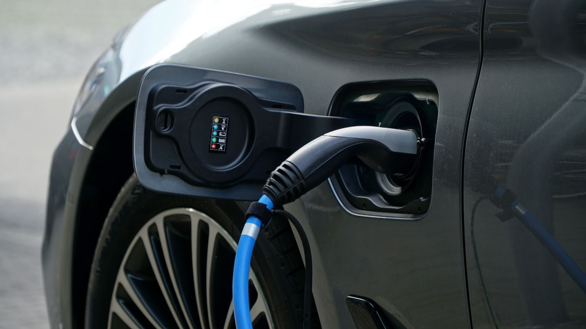 An electric car recharging its battery