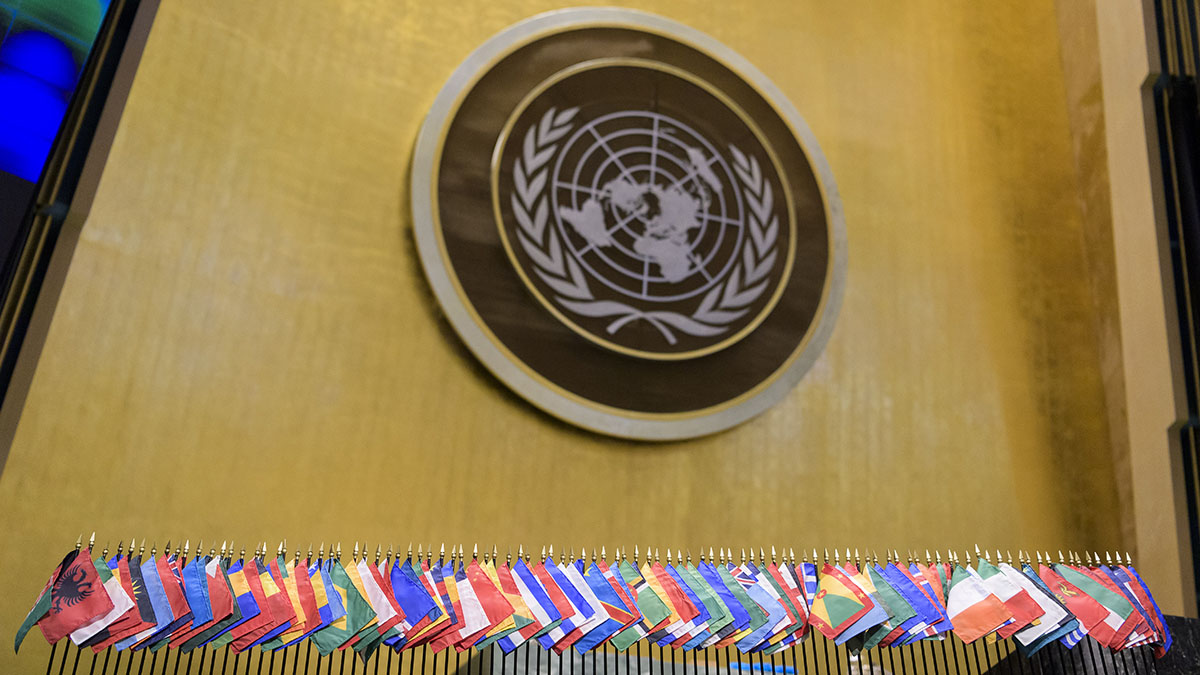 UNHQ general assembly hall with flags on stage