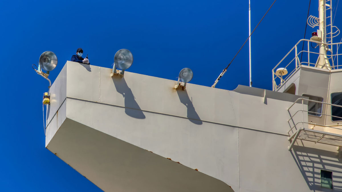 Worker on a vessel wearing a COVID-19 mask