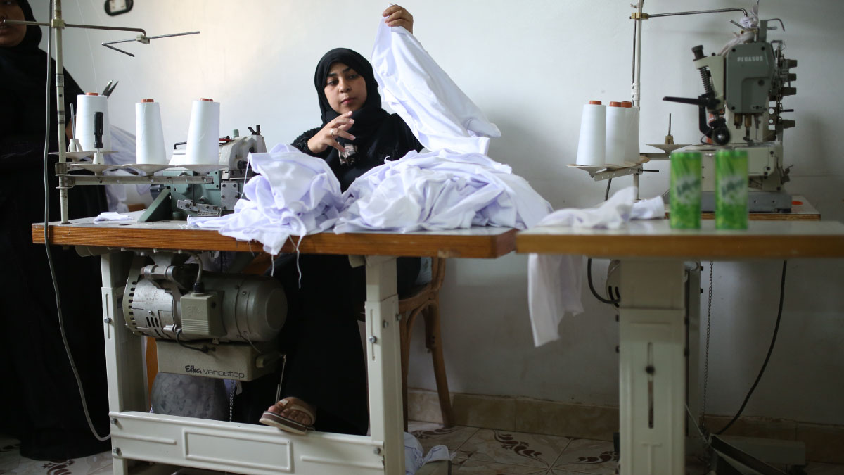 Woman sews clothes in Egypt