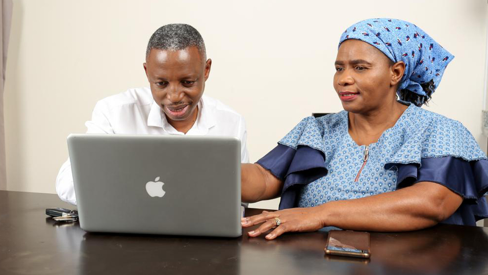 African man and woman work on computer