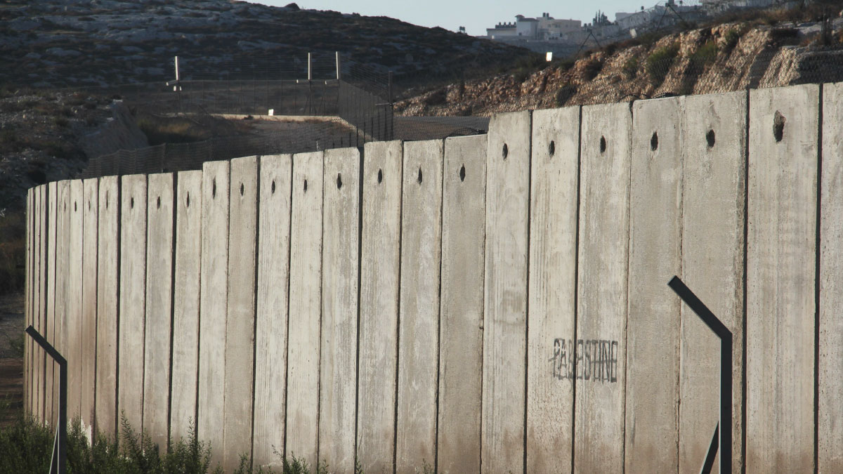 A section of the concrete Israeli West Bank barrier wall, with the world "Palestine" written on it