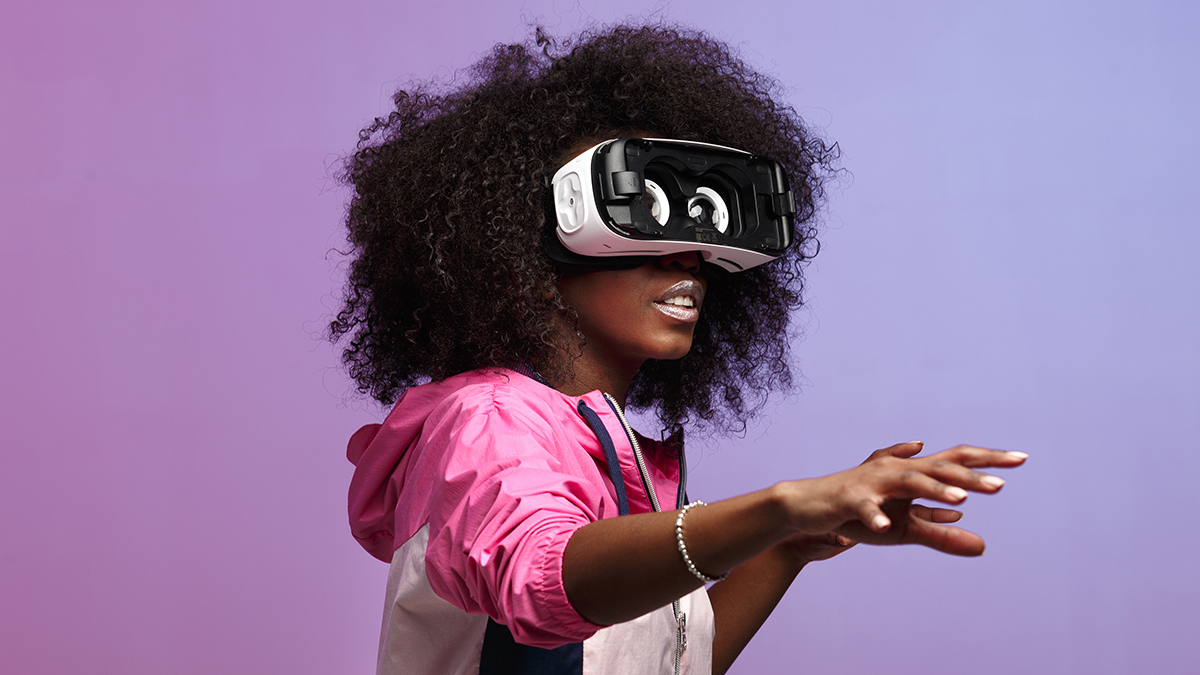 African woman experimenting with virtual reality glasses