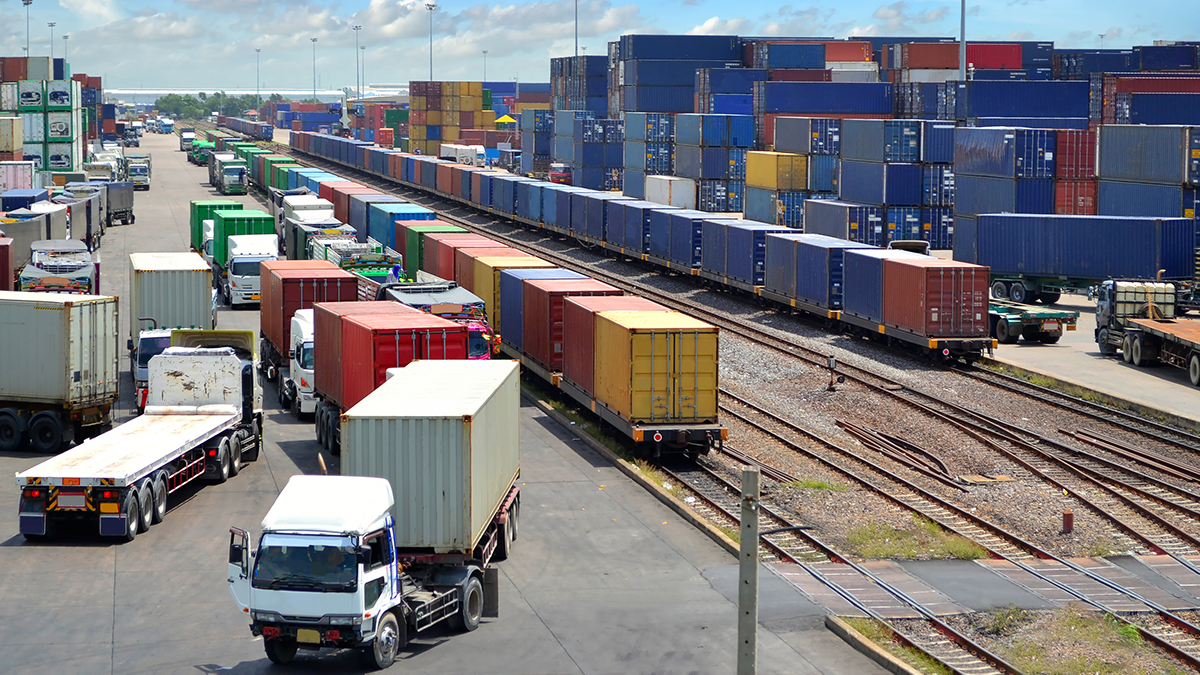 Busy port trade with containers, trucks, trains