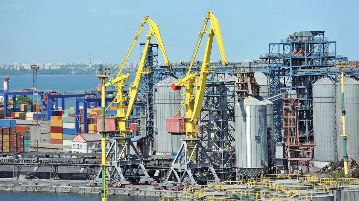 Cargo crane and grain dryer in Odessa port, Ukraine
