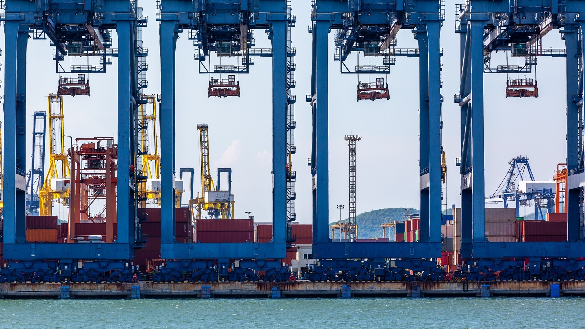 Port cranes load containers.