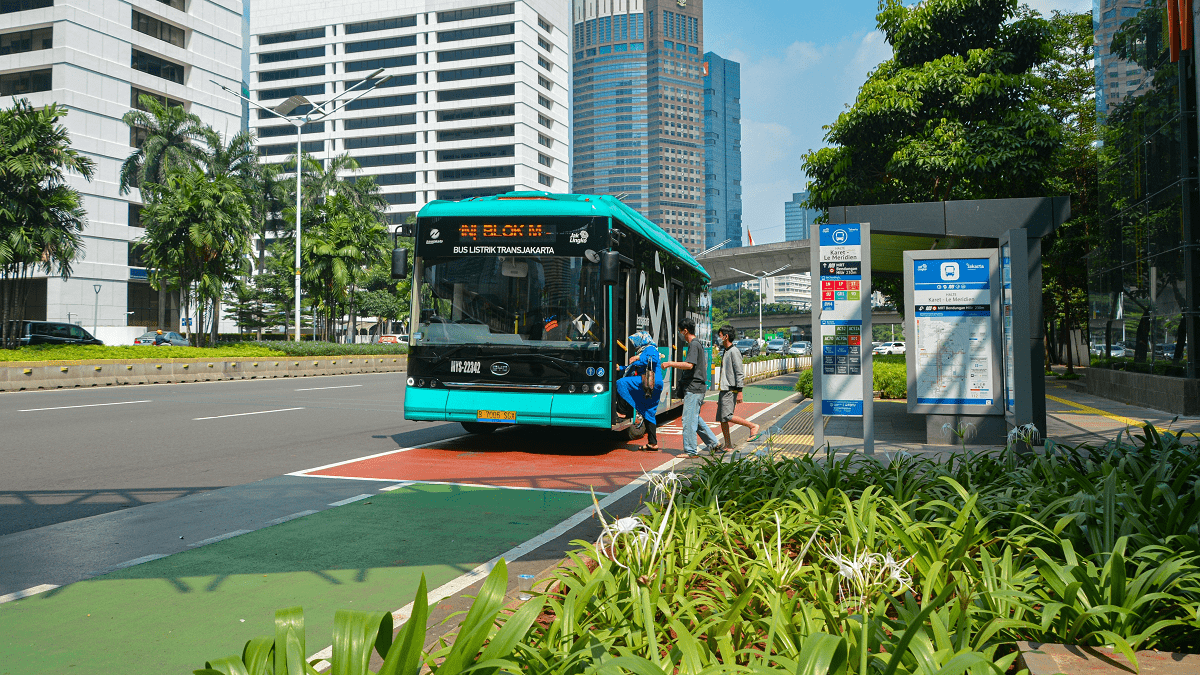 Passengers board an electric bus in central Jakarta, Indonesia.