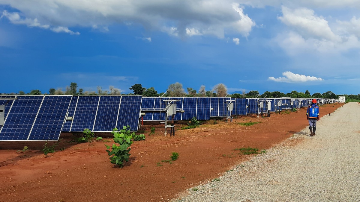 A worker at a solar field in Africa