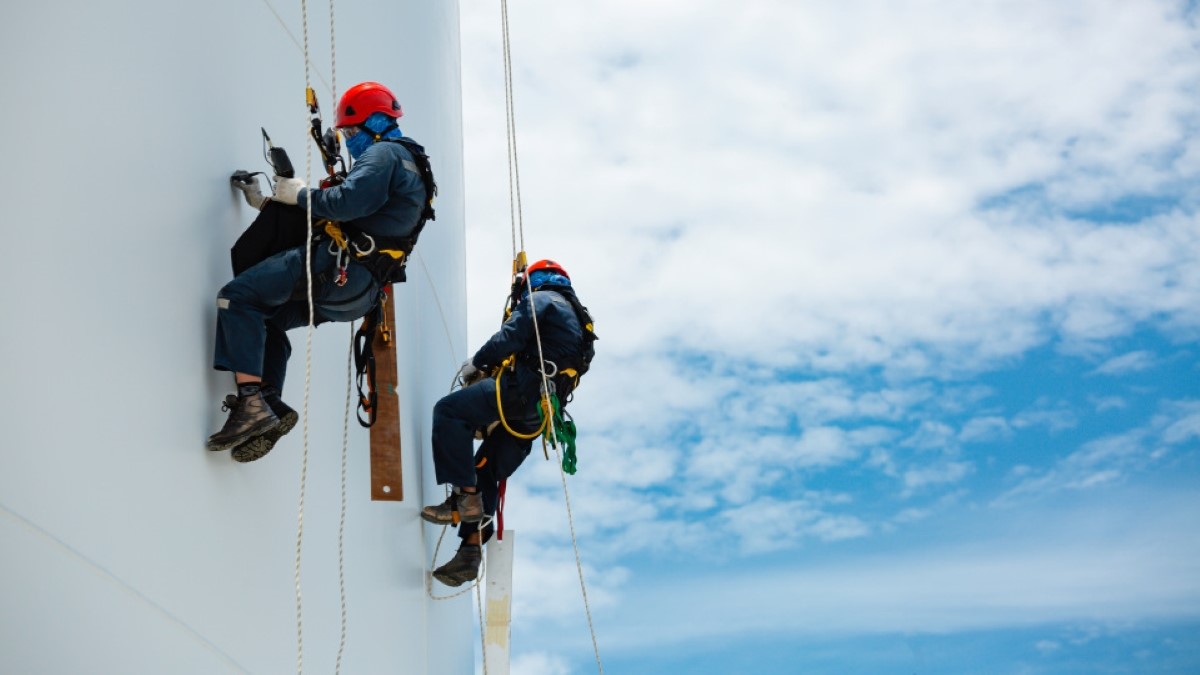 Workers maintaining a wind turbine.