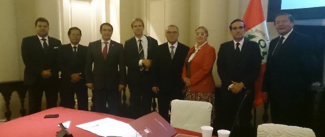Administrative Judges of INDECOPI and the Head of the Swiss Cooperation in Lima, Mr. Christian Robin