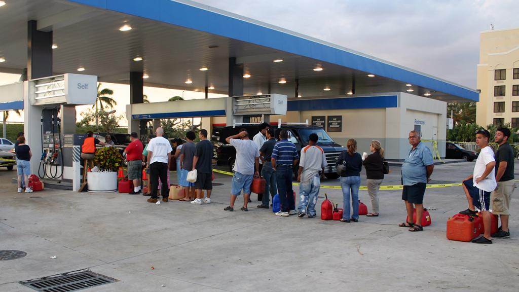 "People wait in line for gas."