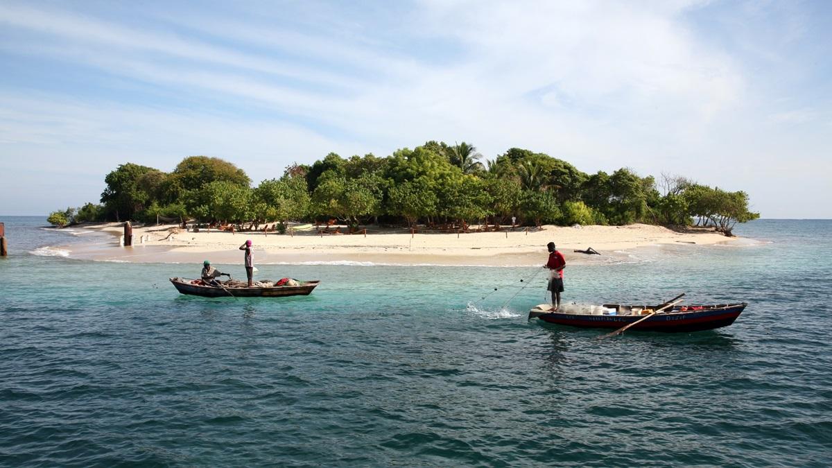 Haitians fish on the western Caribbean waters near the Port of Labadee.