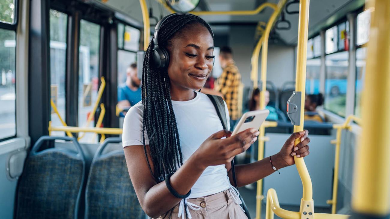 Woman listening to music in public space