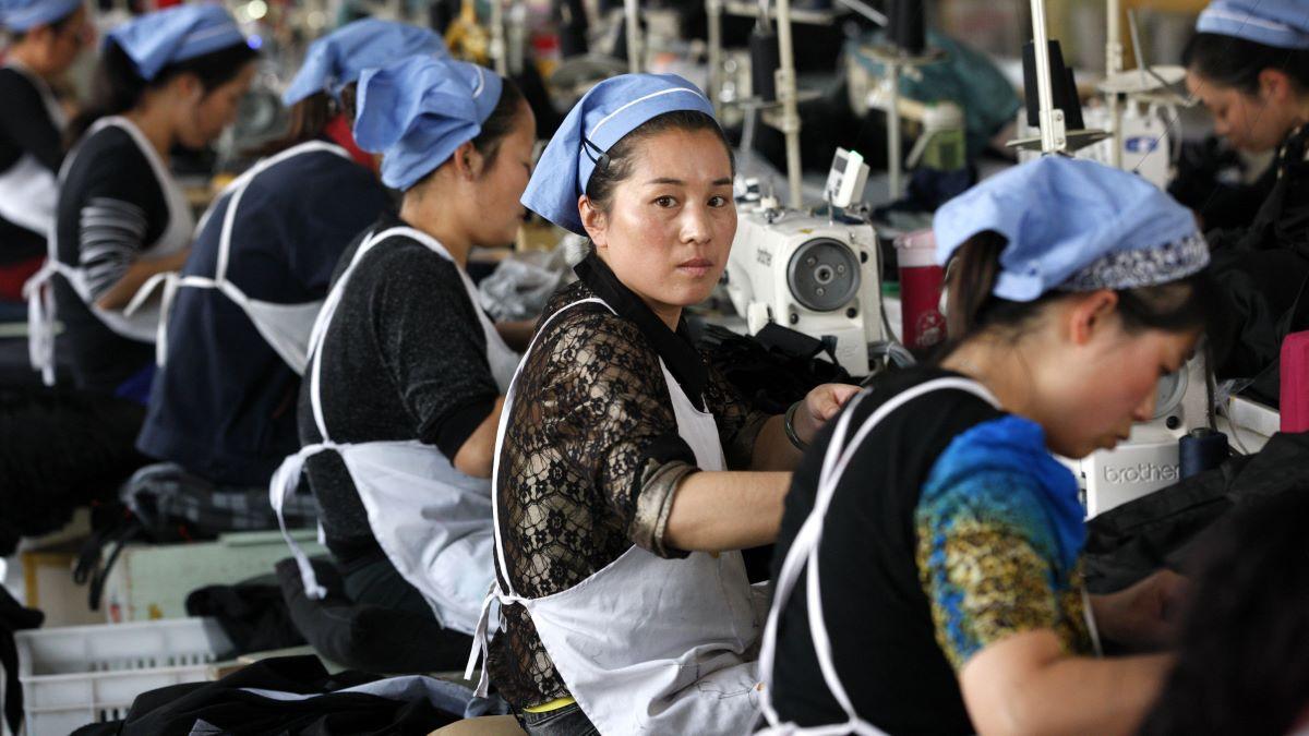 Workers in a textile factory in East China