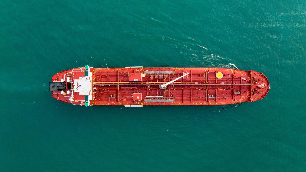 Aerial top view of oil tanker ship sailing on open sea