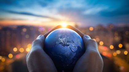 Planet held in someone's hands