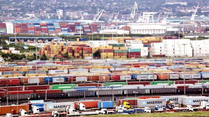 Trucks, trains and ships in a port in South Africa