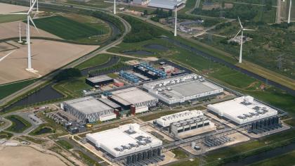 A hyperscale data centre uses energy produced by wind turbines in Groningen, the Kingdom of the Netherlands.