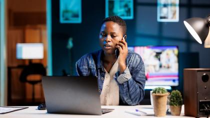 A woman business owner on the phone