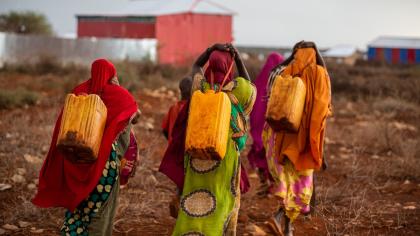 Women trudge miles to fetch safe drinking water in Baidoa Somalia. 