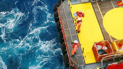 Oil cargo transfer operations at sea.