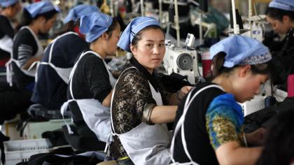 Workers in a textile factory in East China