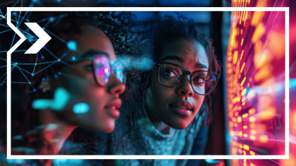 Two young women analyze data