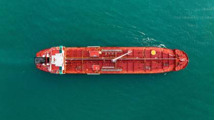 Aerial top view of oil tanker ship sailing on open sea